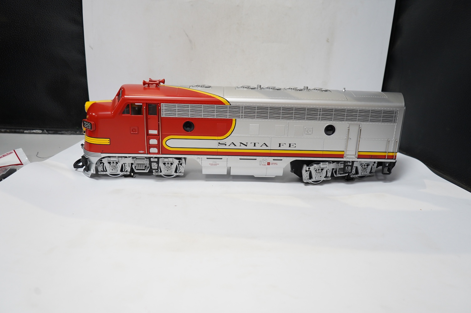 A boxed Lehman LGB (20570) G scale railway Santa Fe Bo-Bo diesel locomotive, 329, in red and silver livery. Condition - good, evidence of very minor running wear only.